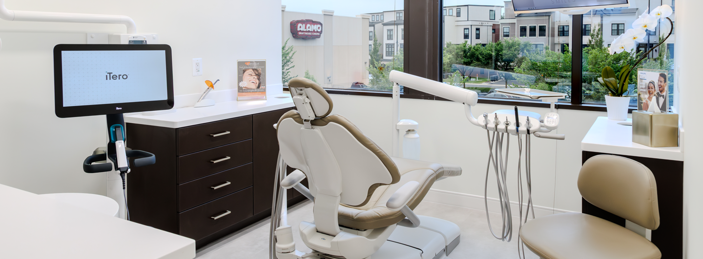 Luxurious POSH Smiles waiting room with marble fireplace